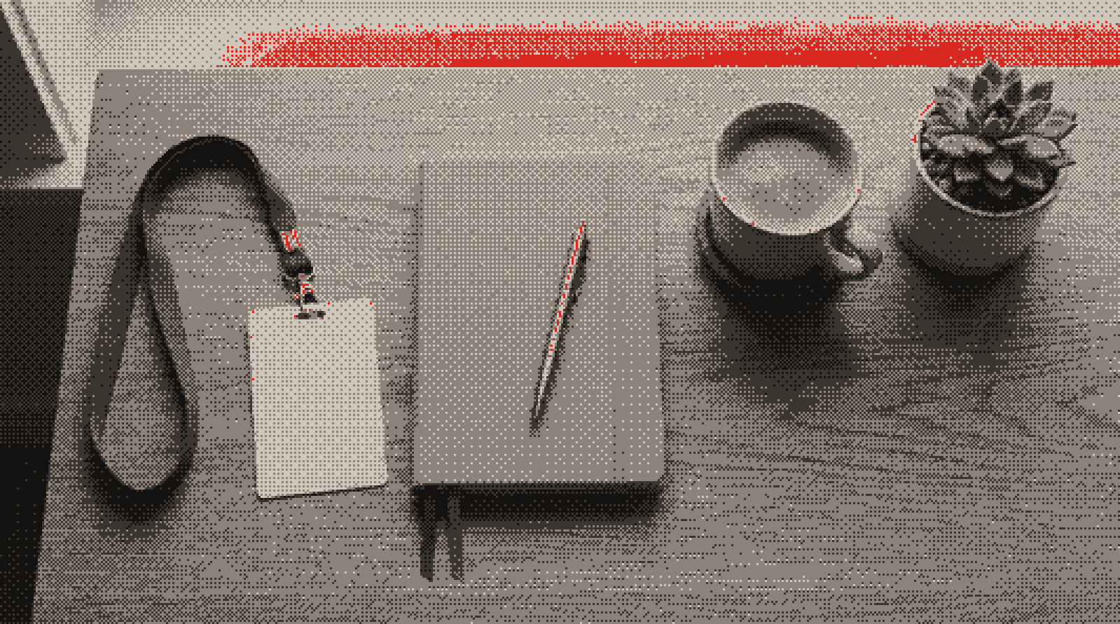 New-starter welcome kit: blank ID badge, notebook, pen, coffee and a plant (illustrative)