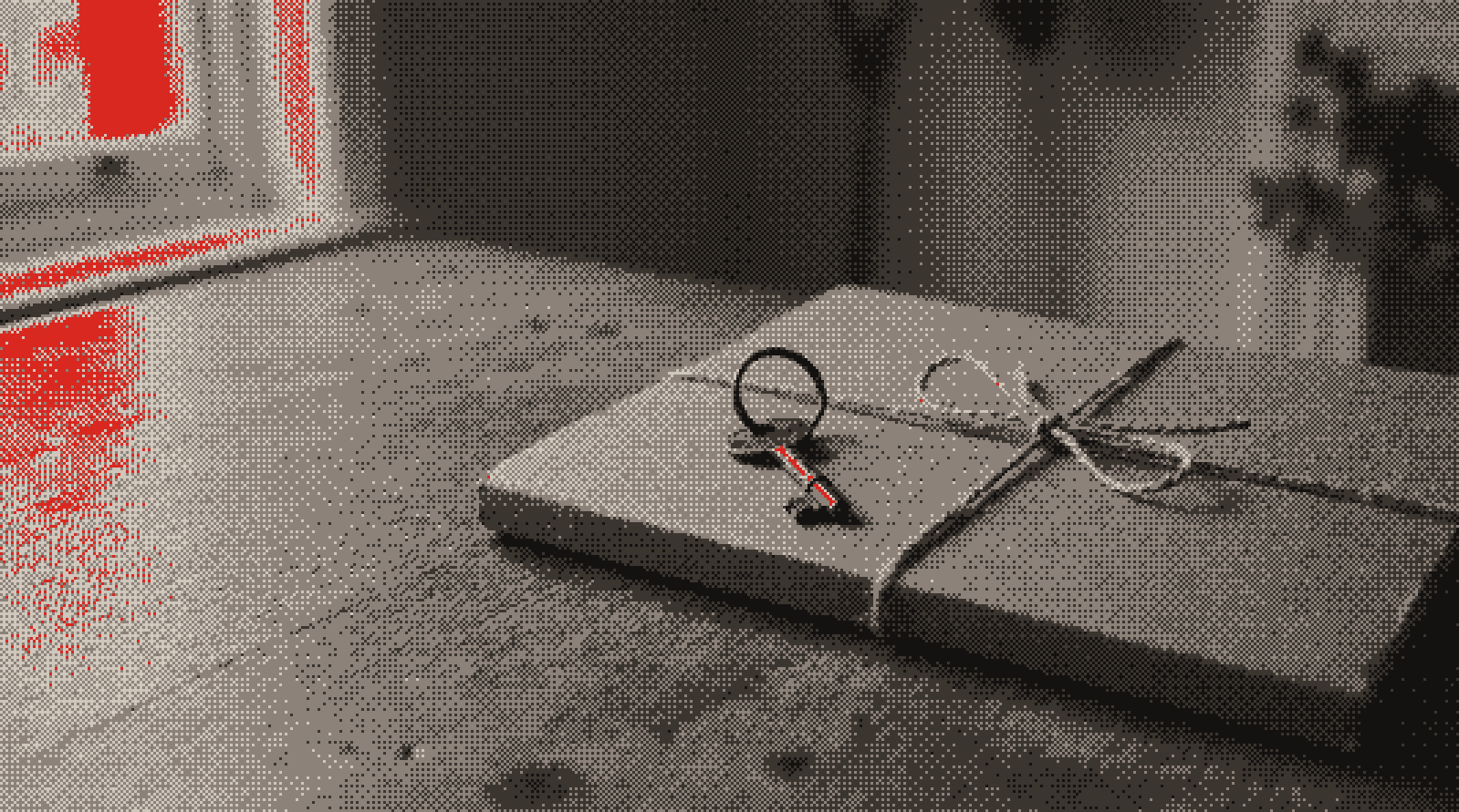 A key resting on a folder tied with string (illustrative)